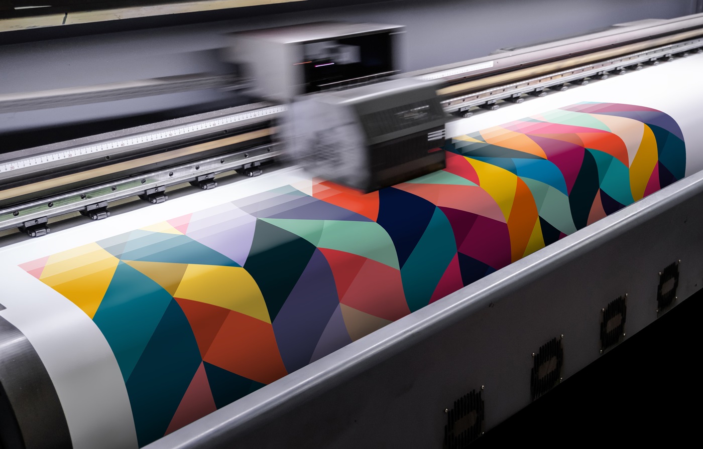 the printer prints a colorful pattern on the textile material