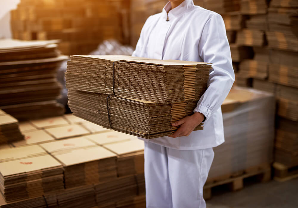 man carrying new carton boxes