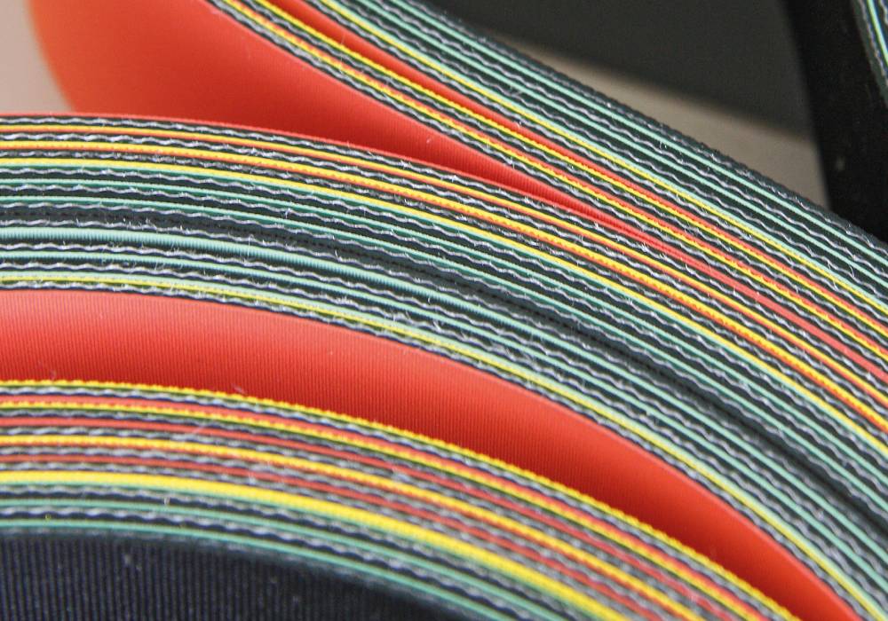 Fabric based conveyor and processing belts