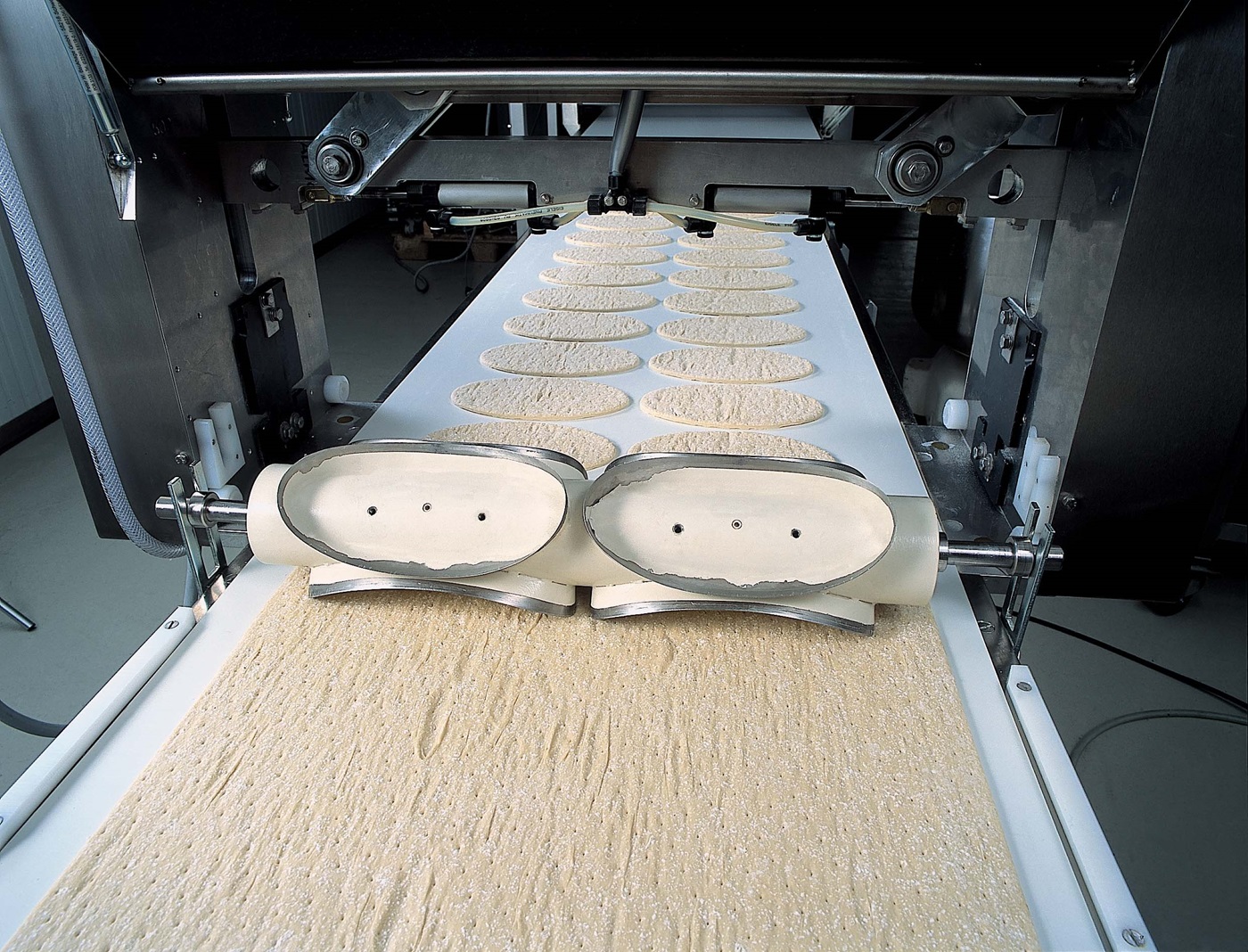Dough being conveyed on a belt